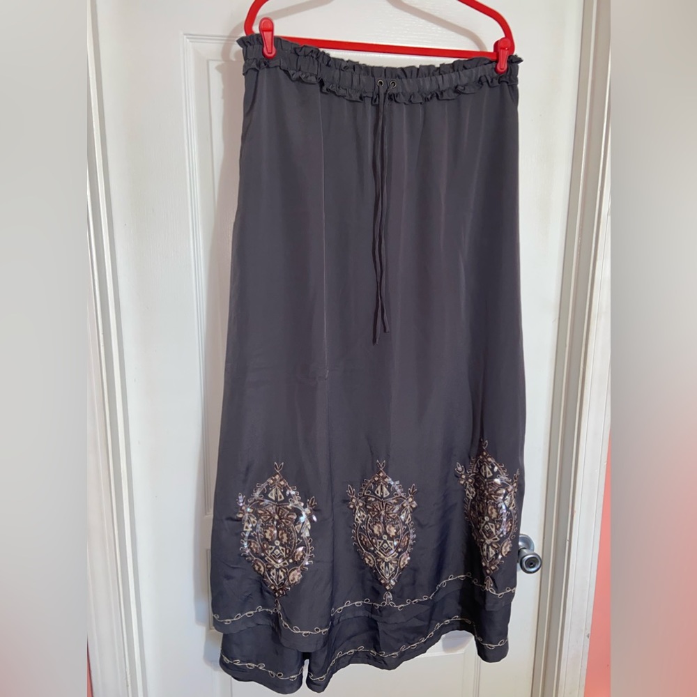 NWT woman’s garment in sz 12, color is like dark grey with beautiful stitching.